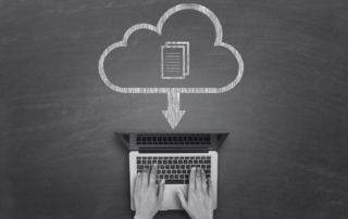 A chalkboard drawing of a document downloading from a cloud onto a laptop.