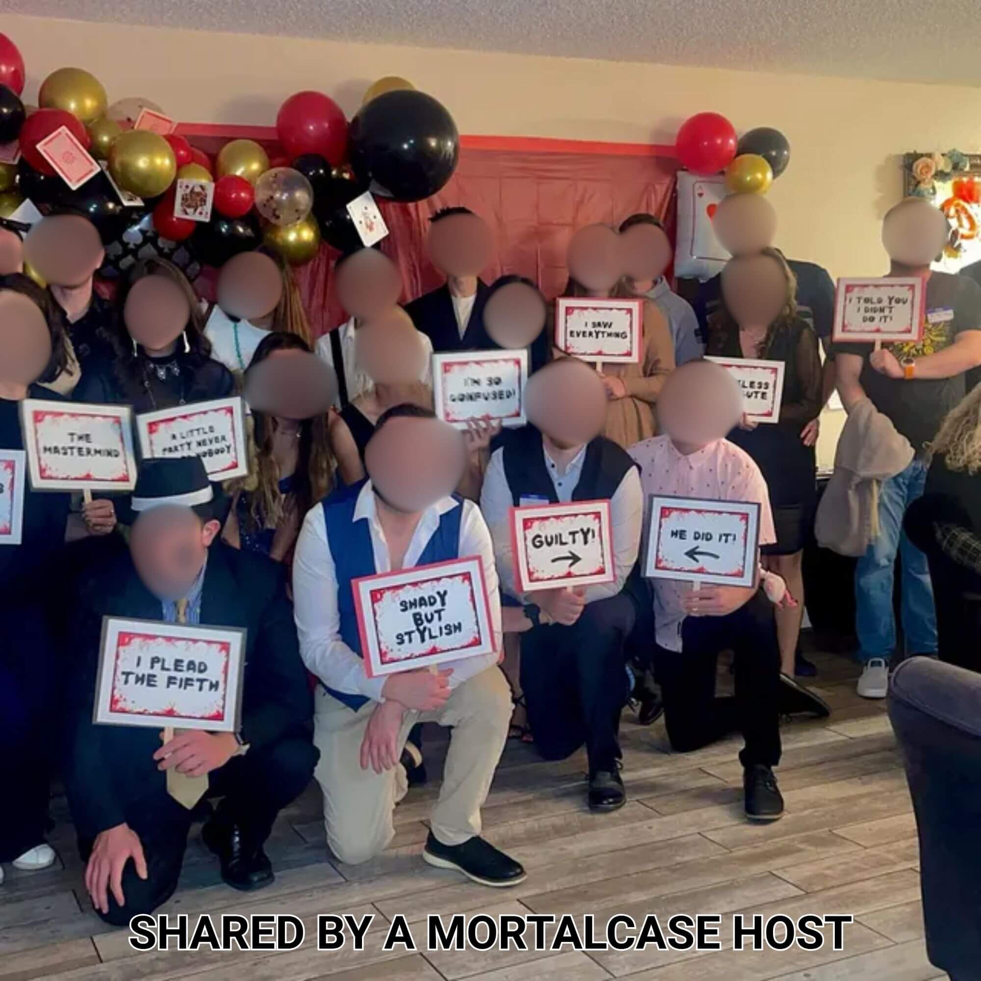 Large group playing Casino Killer: High-Stakes Murder beneath red, black and gold casino balloons.